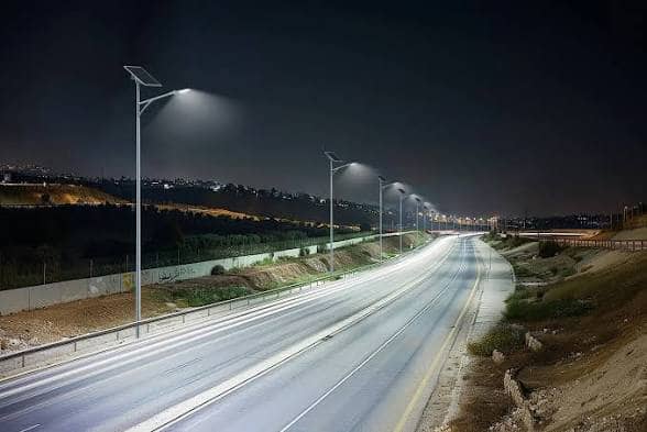 Solar powered streetlights lighting a road at night